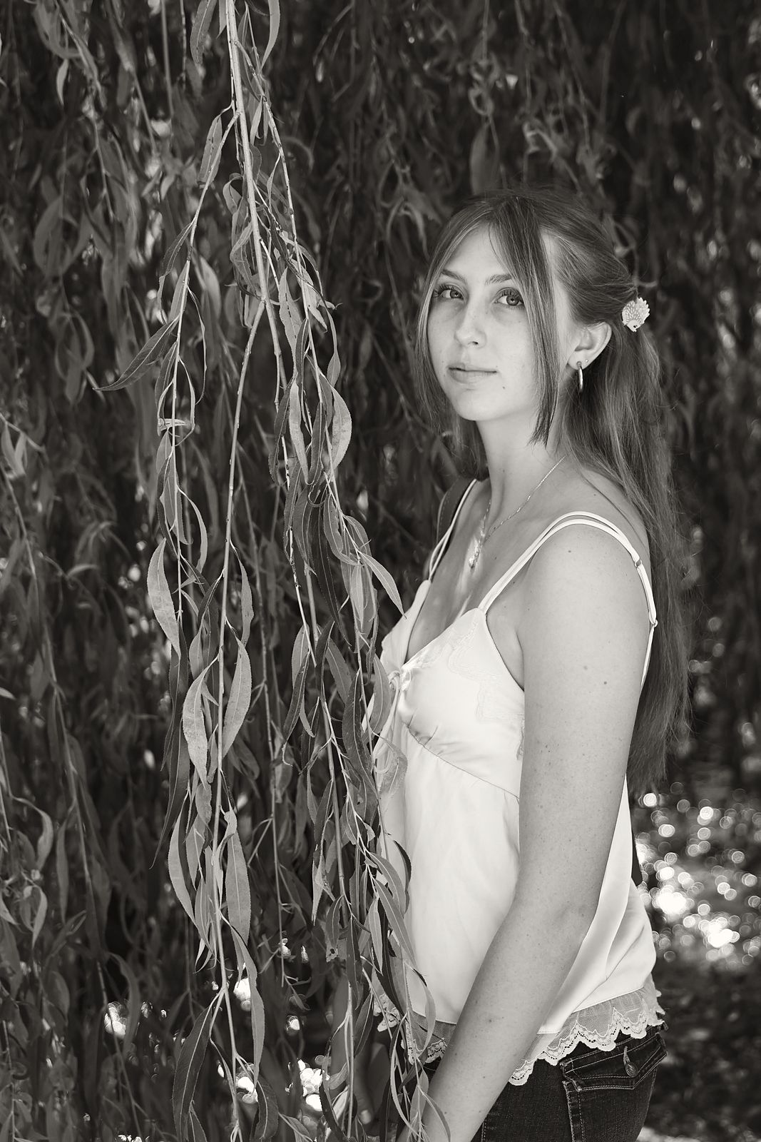 Three-quarter portrait framed by willow branches